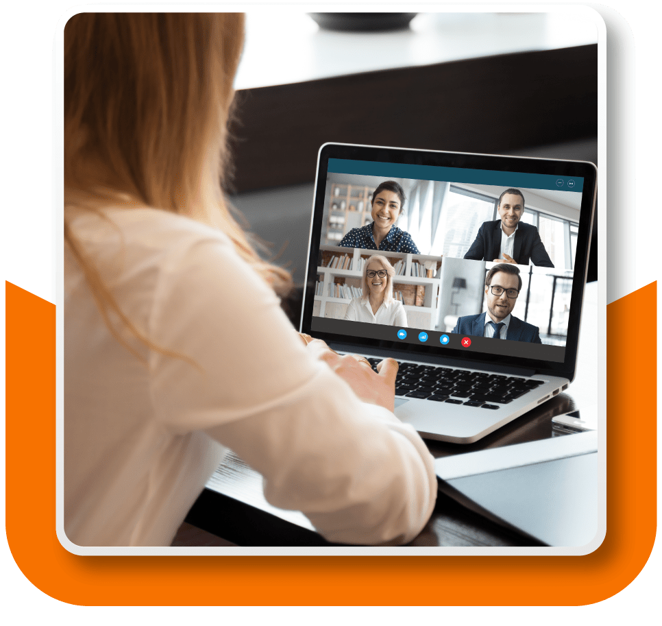 Framed image of a woman facing away from the camera as she's on a video call with four of her colleagues.