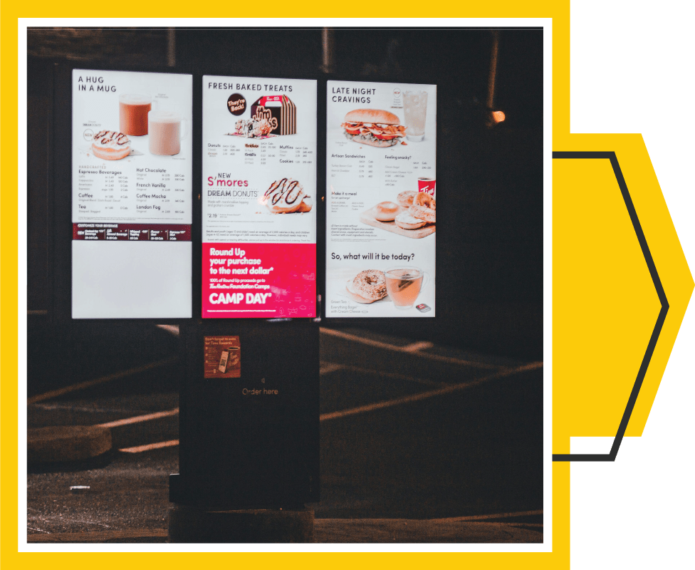 Framed image of a set of three outdoor fast-food menu boards, a perfect example of multiple digital signs working together.