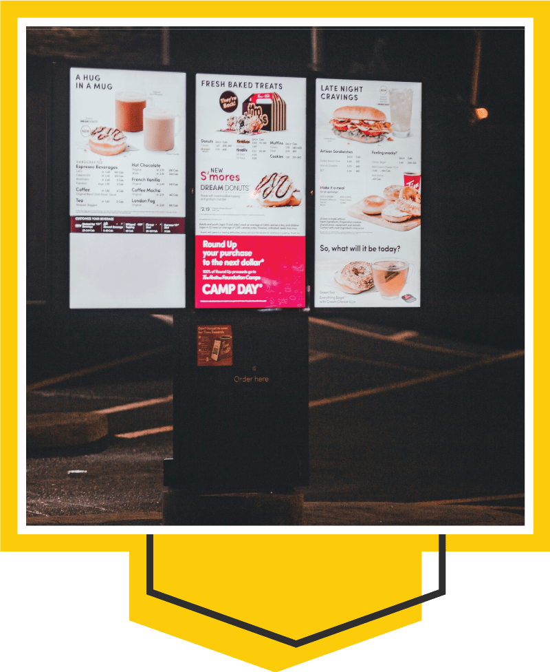 Framed image of a set of three outdoor fast-food menu boards.