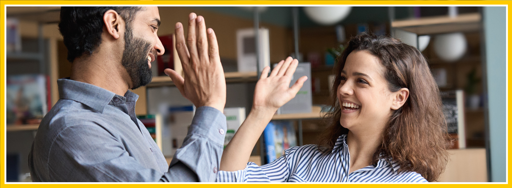 Framed image of two people high fiving - we love working with our manufacturing partners!