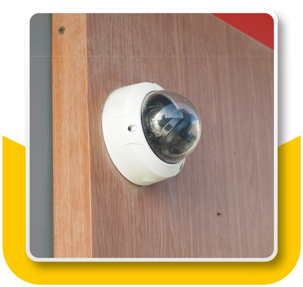 Framed Image: Close-up of a security camera on the wall of a bank.
