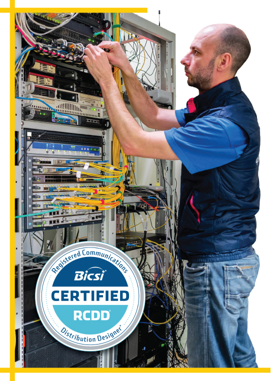 RCDD-certified tech working on the cabling for a car dealership