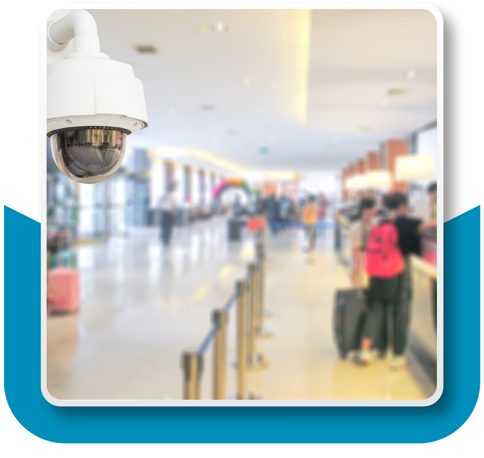 Framed Image: Surveillance camera in the top left of the foreground, trained on a hotel lobby in the background