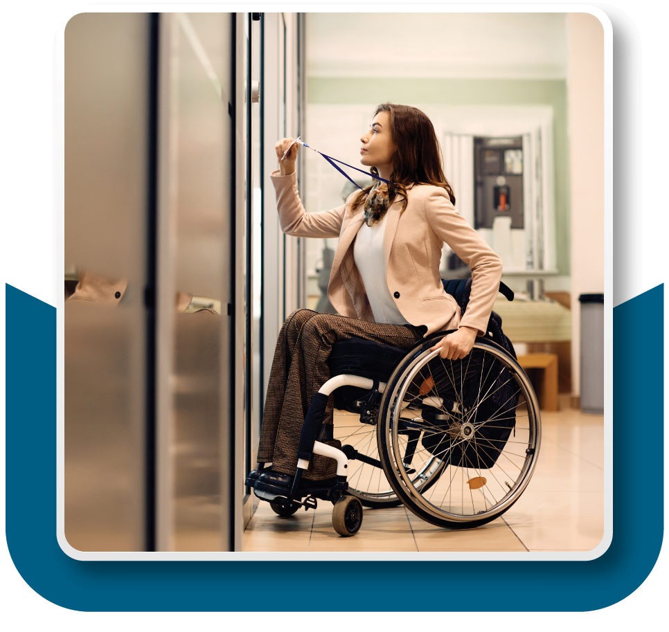 Framed Image: A woman in a wheelchair is using her keycard badge on an access control system to enter a specific part of the building.