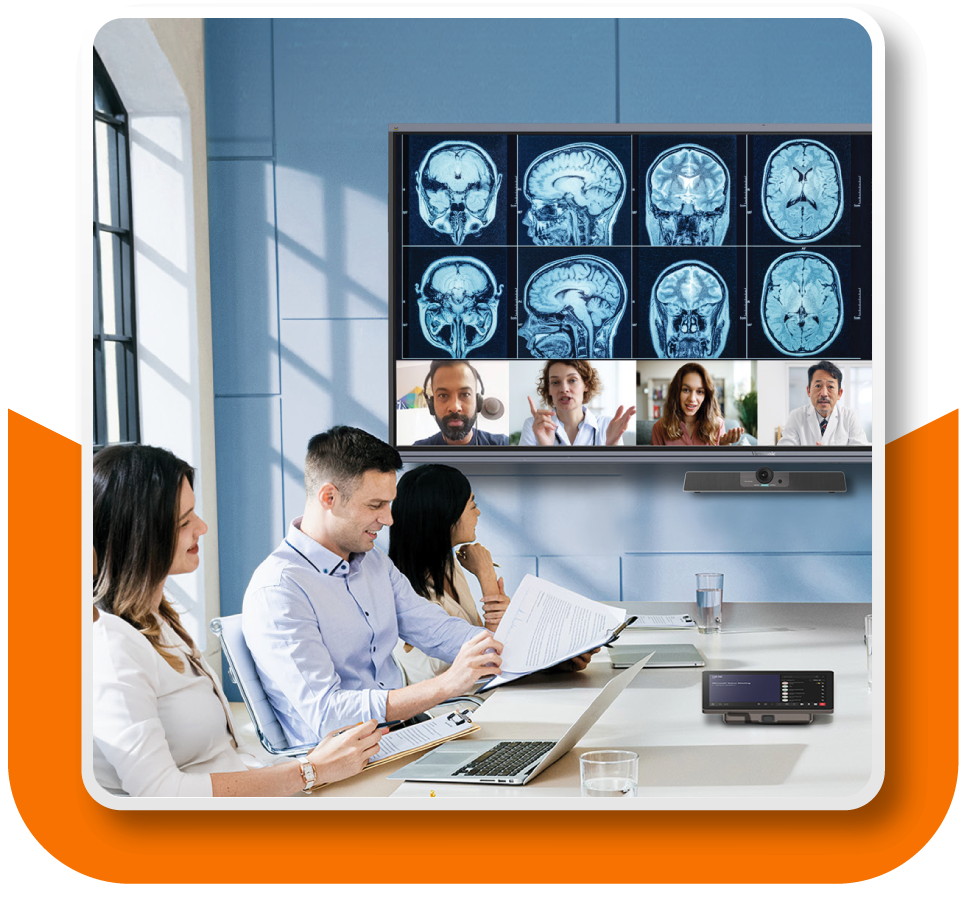 Framed Image: A team of doctors and medical staff are gathered at a conference table with a video screen in the background - more medical professionals are joining the meeting remotely through this screen.