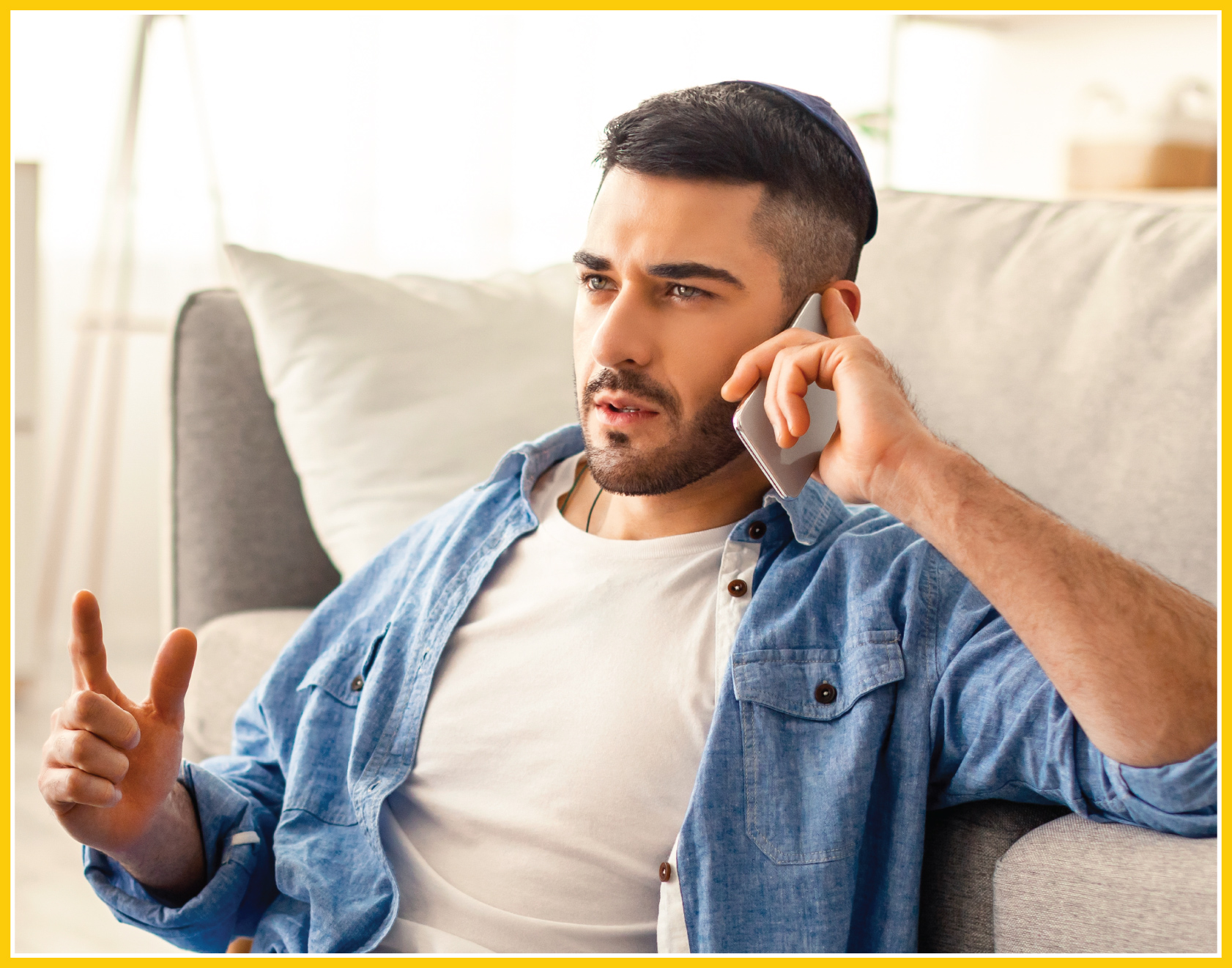 A rabbi on a phone call discussing religious matters with his team