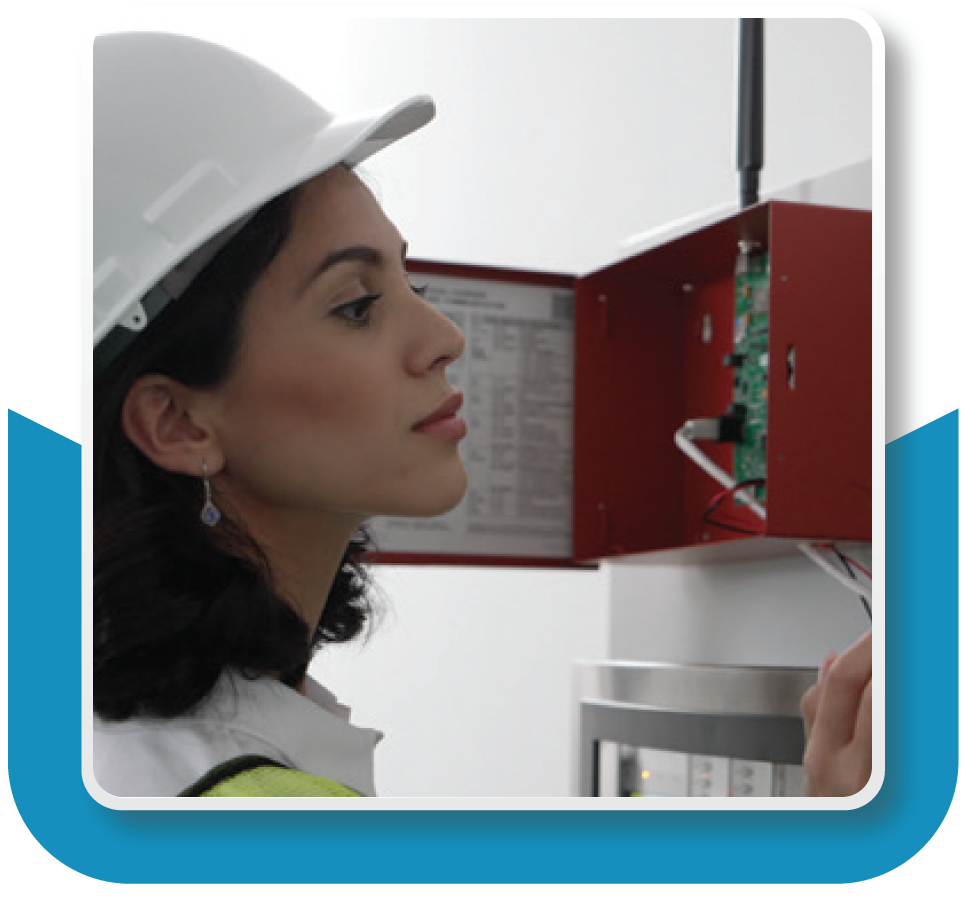 Closeup of a fire alarm technician inspecting a system