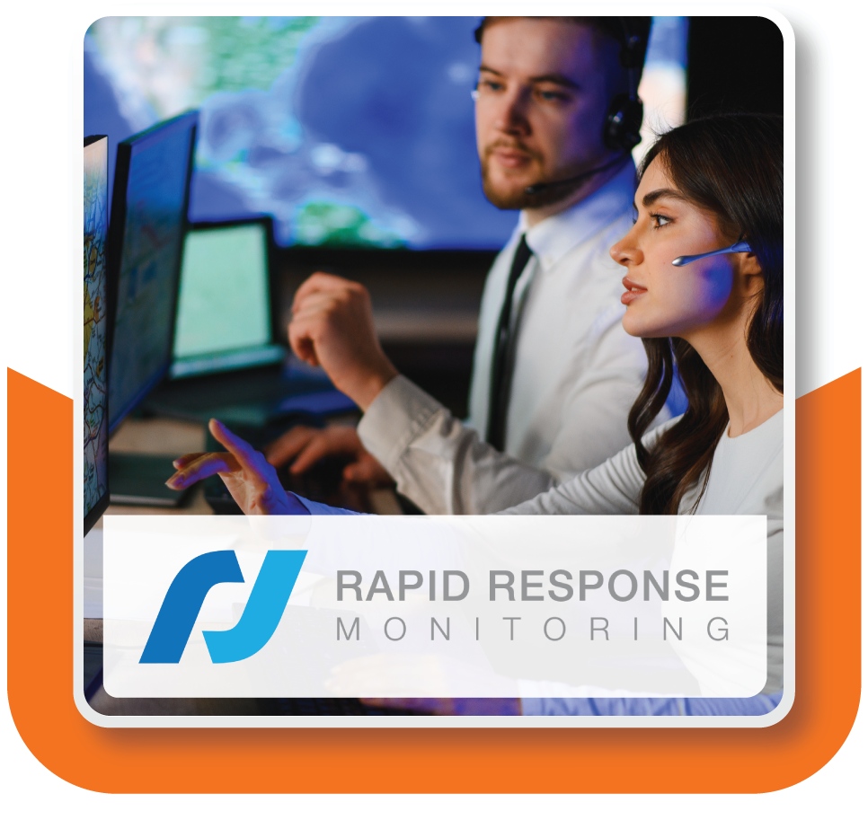 Two live monitoring agents from Rapid Response Monitoring sat at their computers reviewing a livestream of a commercial business
